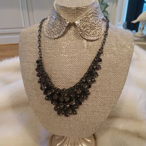 Black necklace with a brown/black hue
